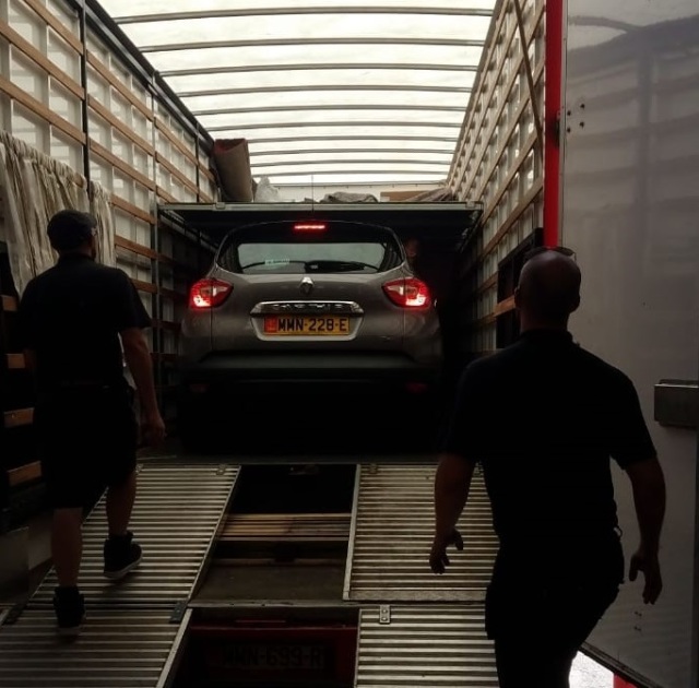 Car loaded on to removal van